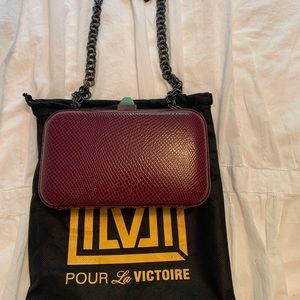 POUR LA VICTOIRE Leather crocodile embossed clutch
